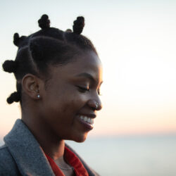 Pretty young black lady portrait at sunset.